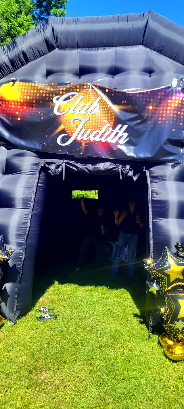 Club Judith inflatable nightclub entrance with disco ball signage